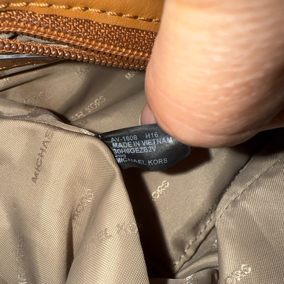 Michael Kors Dark Brown Backpack with Gold Accents. See callouts